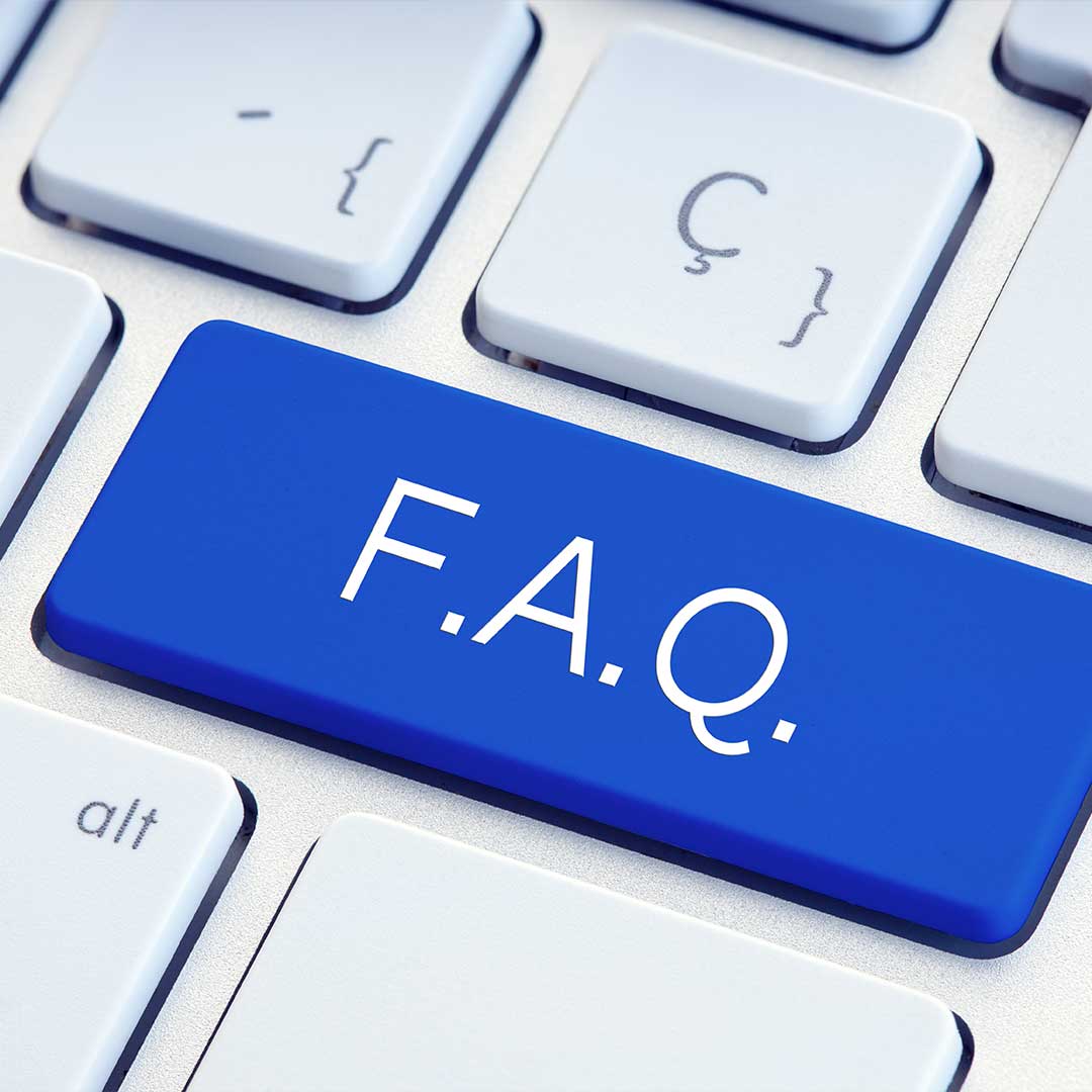 Computer keyboard with odd signs and blue key that says FAQ
