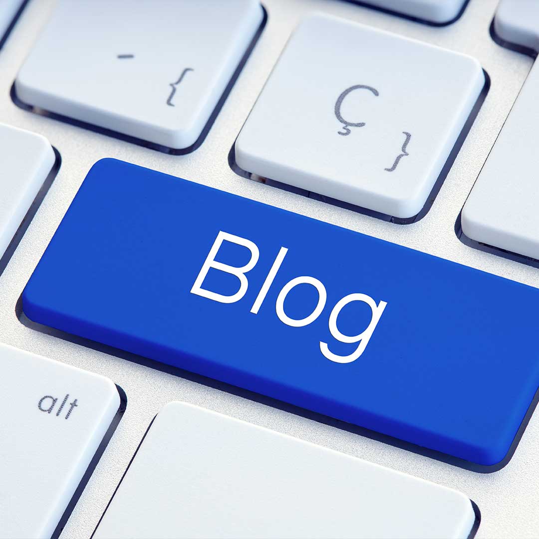 white keyboard with blue button that says, "Blog"